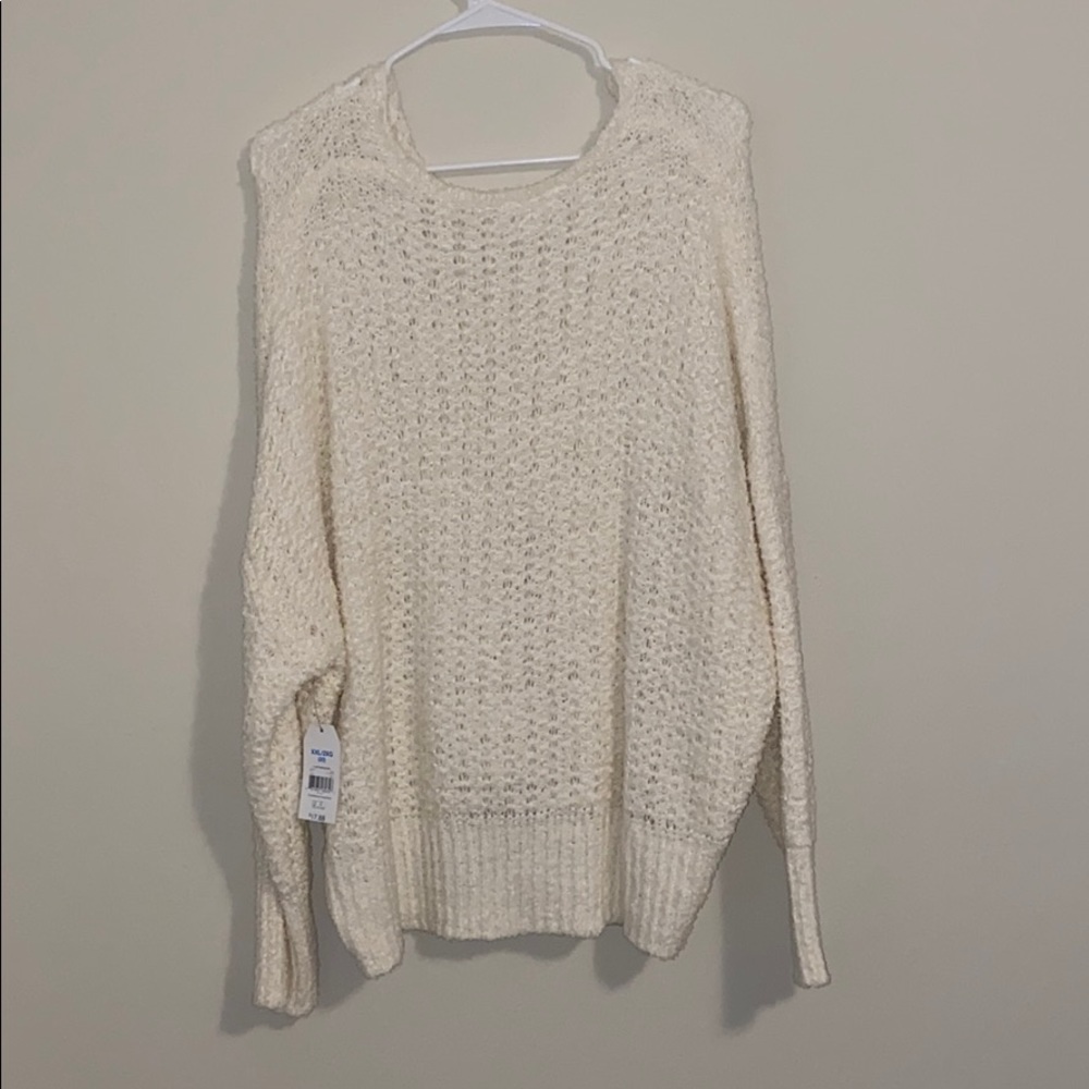 sweater needs something worn underneath